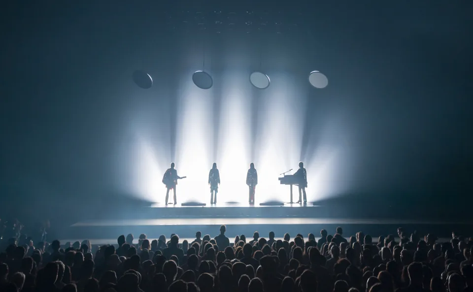 ABBA in silhouette with guitars and keyboard in white light, ABBA Voyage, ABBA Arena