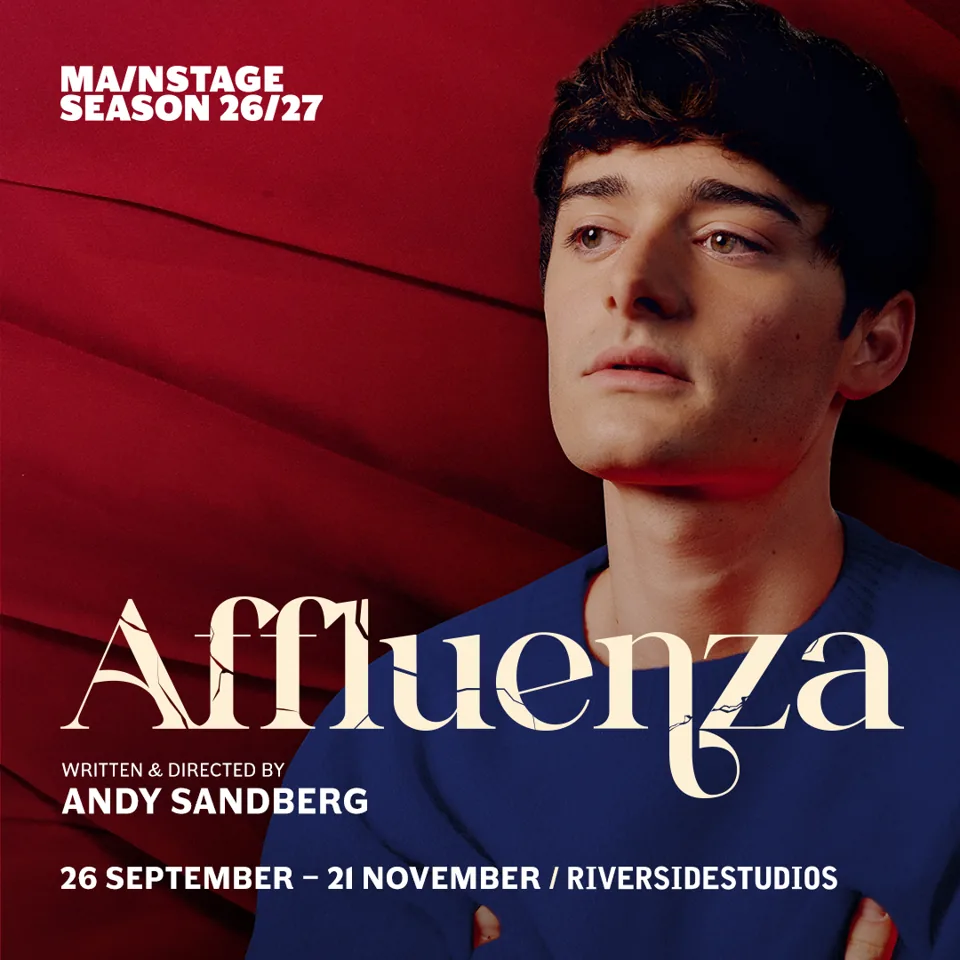 Person in blue shirt against red background in Affluenza at the Riverside Studios