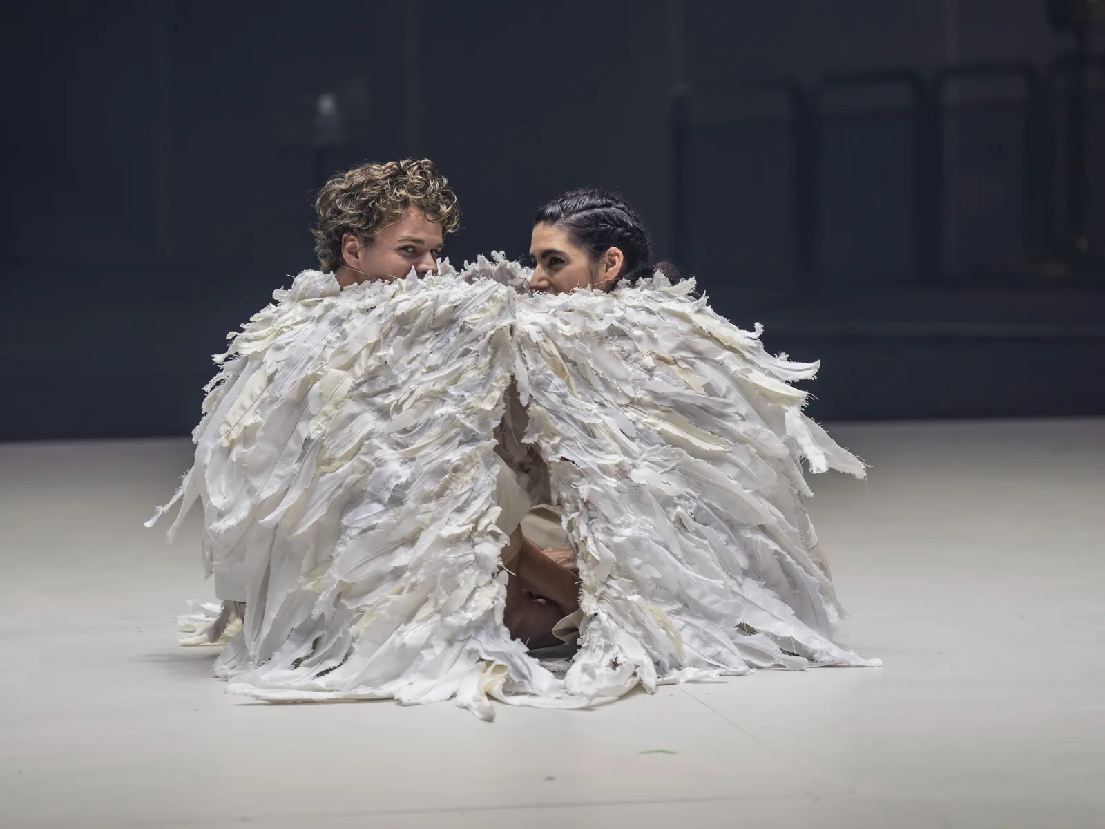 Matthew McKinney and Mariam Wallentin share one feathered costume, Angel's Bone, London Coliseum