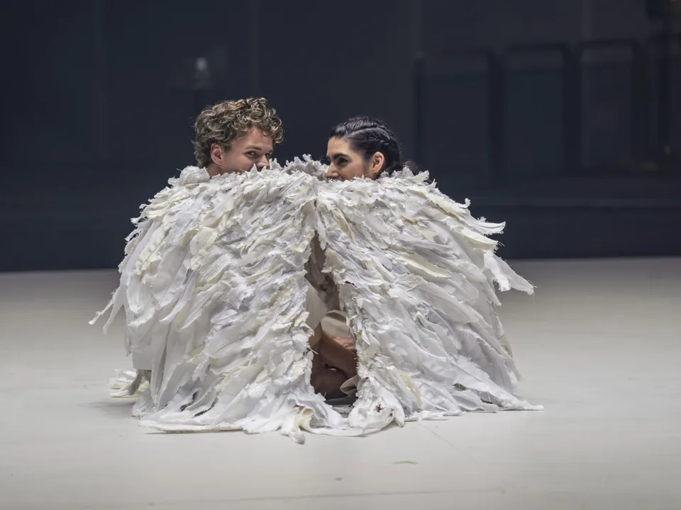 Matthew McKinney and Mariam Wallentin share one feathered costume, Angel's Bone, London Coliseum