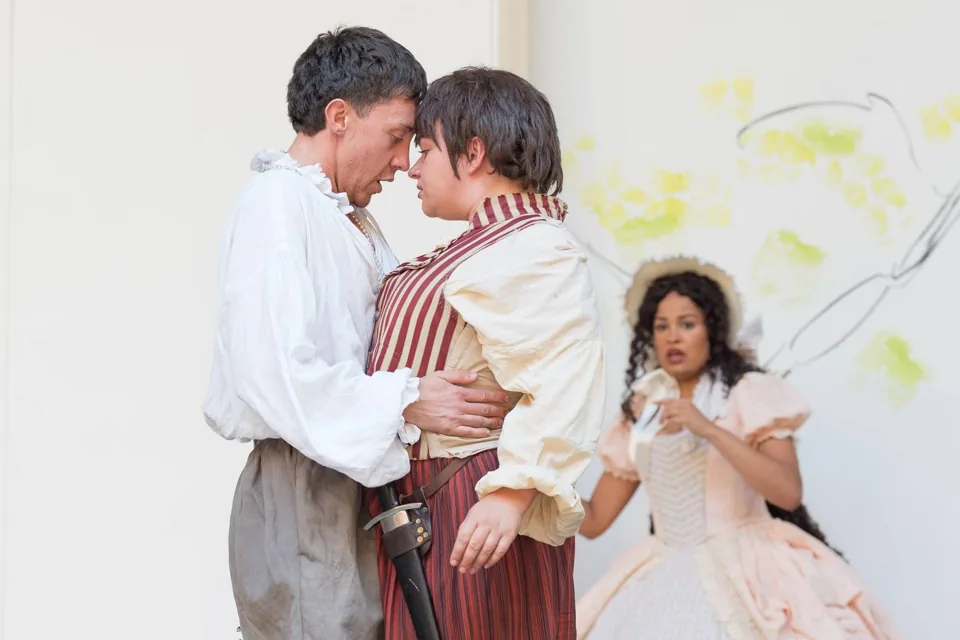 Two lovers embrace forehead to forehead, As You Like It, Shakespeare's Globe