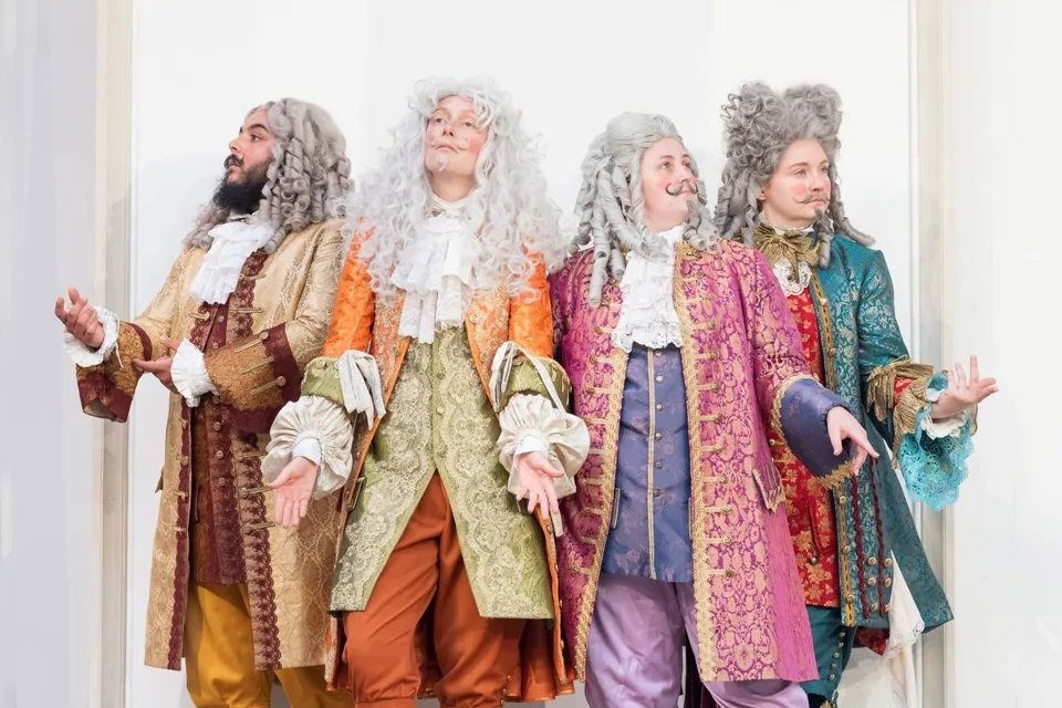 Four courtiers in curled grey wigs, As You Like It at Shakespeare's Globe