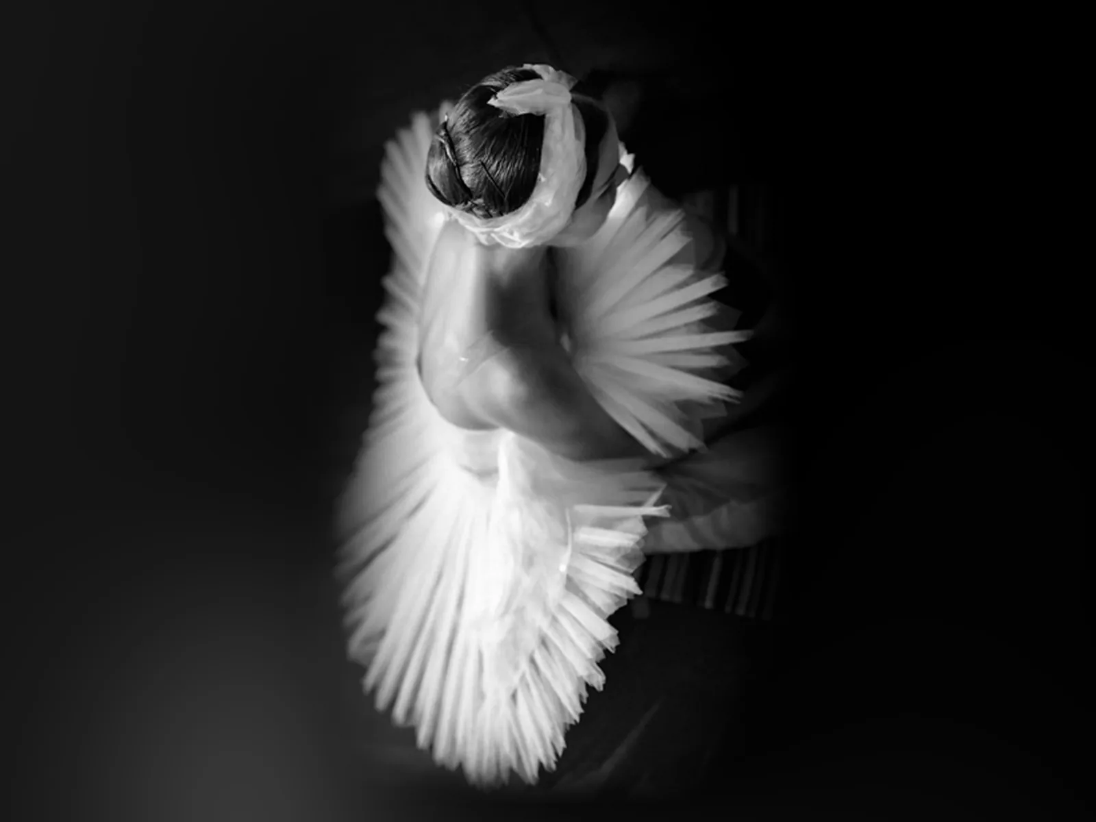 Ballet dancer in white tutu, overhead view in Ballet Icons at London Coliseum