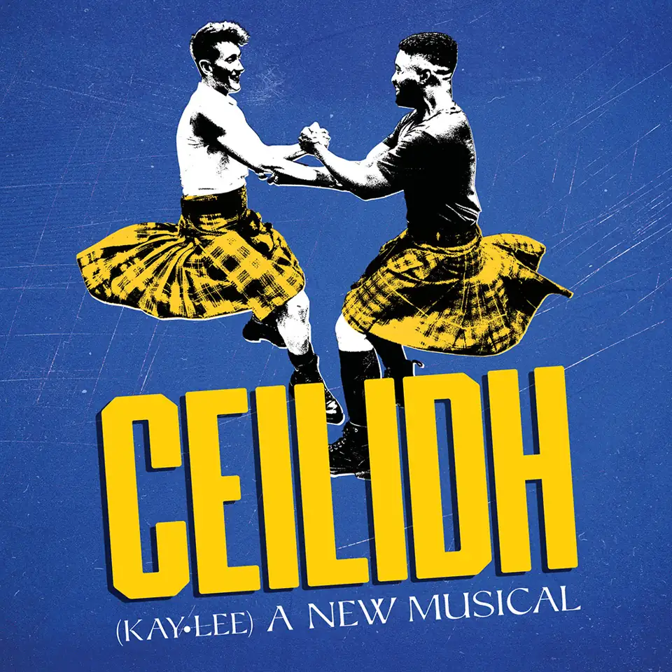 Two men in kilts clasp hands in Ceilidh The Musical at the Shoreditch Town Hall