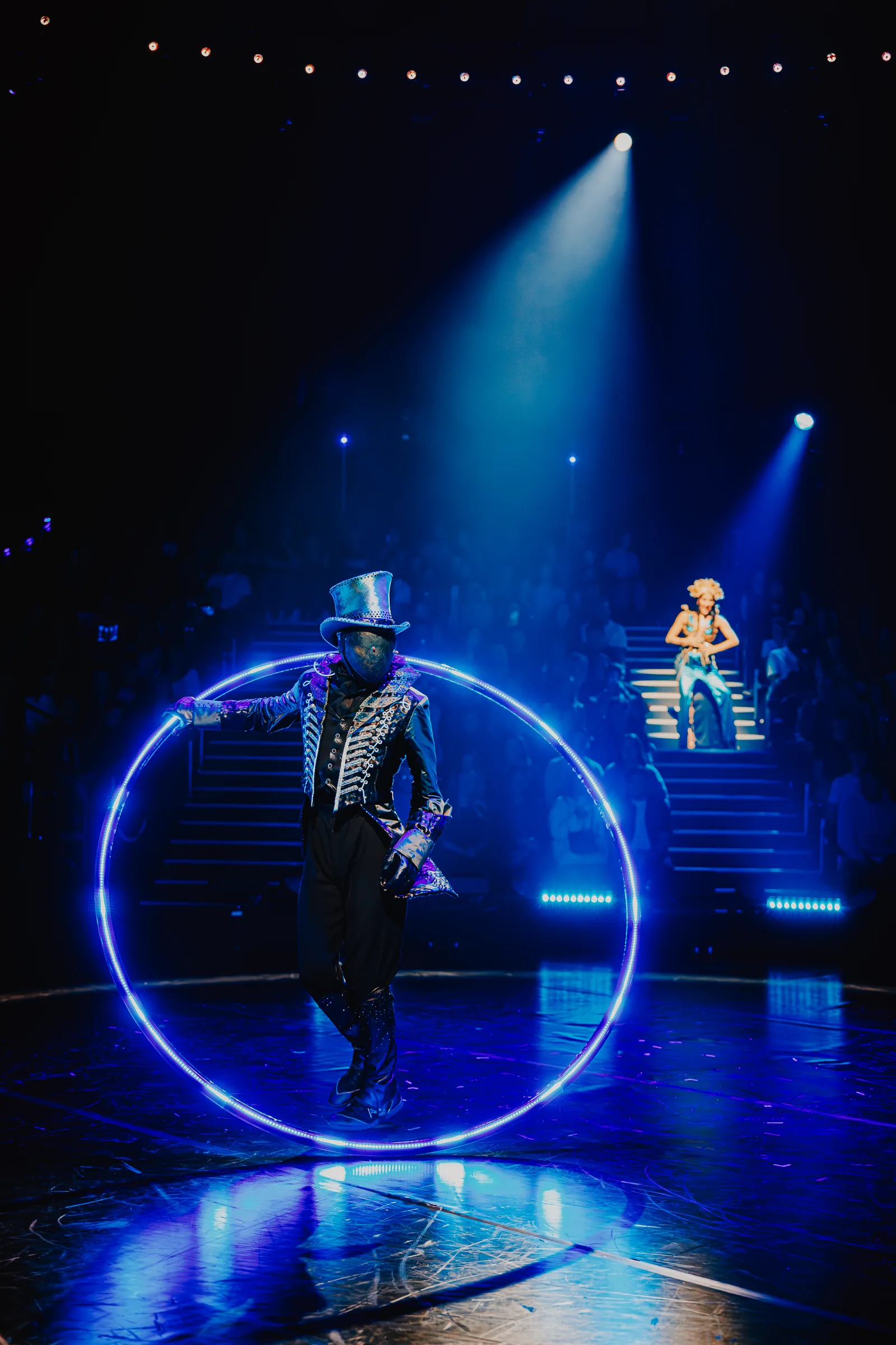 A top-hatted performer steps through a glowing blue hoop, Come Alive!, Empress Museum