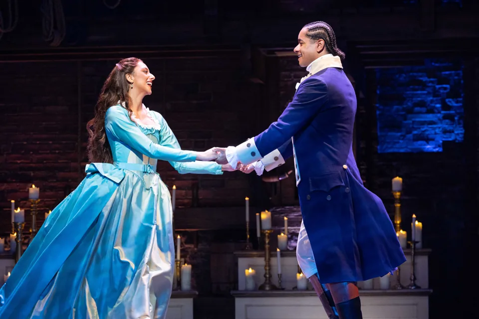 Bente Mulan as Eliza and Stephenson Ardern-Sodje as Hamilton dance among candles, Victoria Palace Theatre