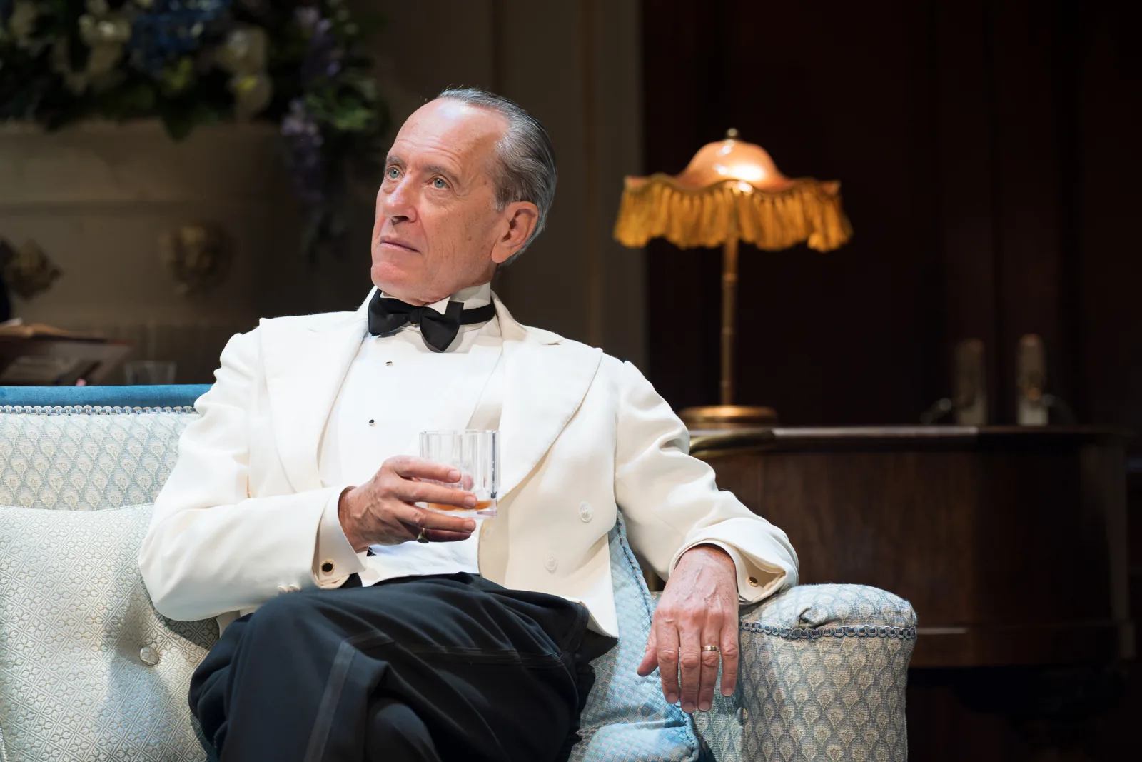 Richard E. Grant as David Bliss in a white dinner jacket, Wyndham's