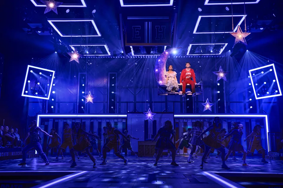 Leonor Correia and Tobias Turley above the dancing company, High School Musical, Wembley Park