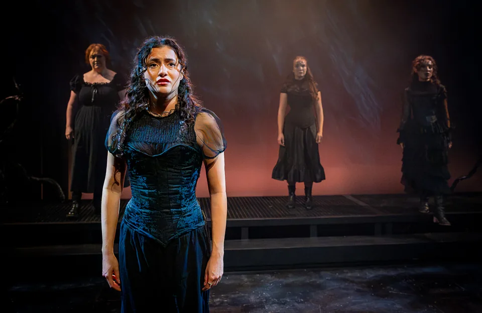 A woman in a blue velvet gown, the company behind, Jane Eyre, Southwark Playhouse