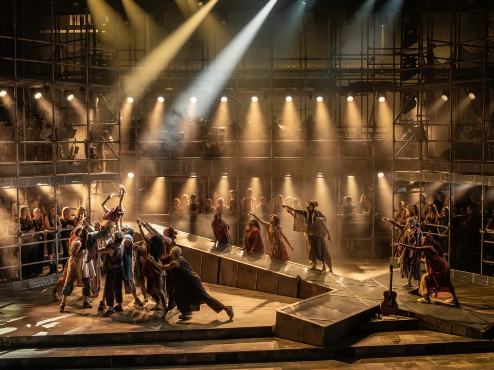 The company in golden light in Jesus Christ Superstar, Theatre Royal Drury Lane
