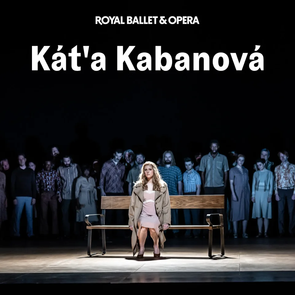 Woman in beige coat on wooden bench in Káťa Kabanová - Royal Ballet and Opera at the Royal Opera House