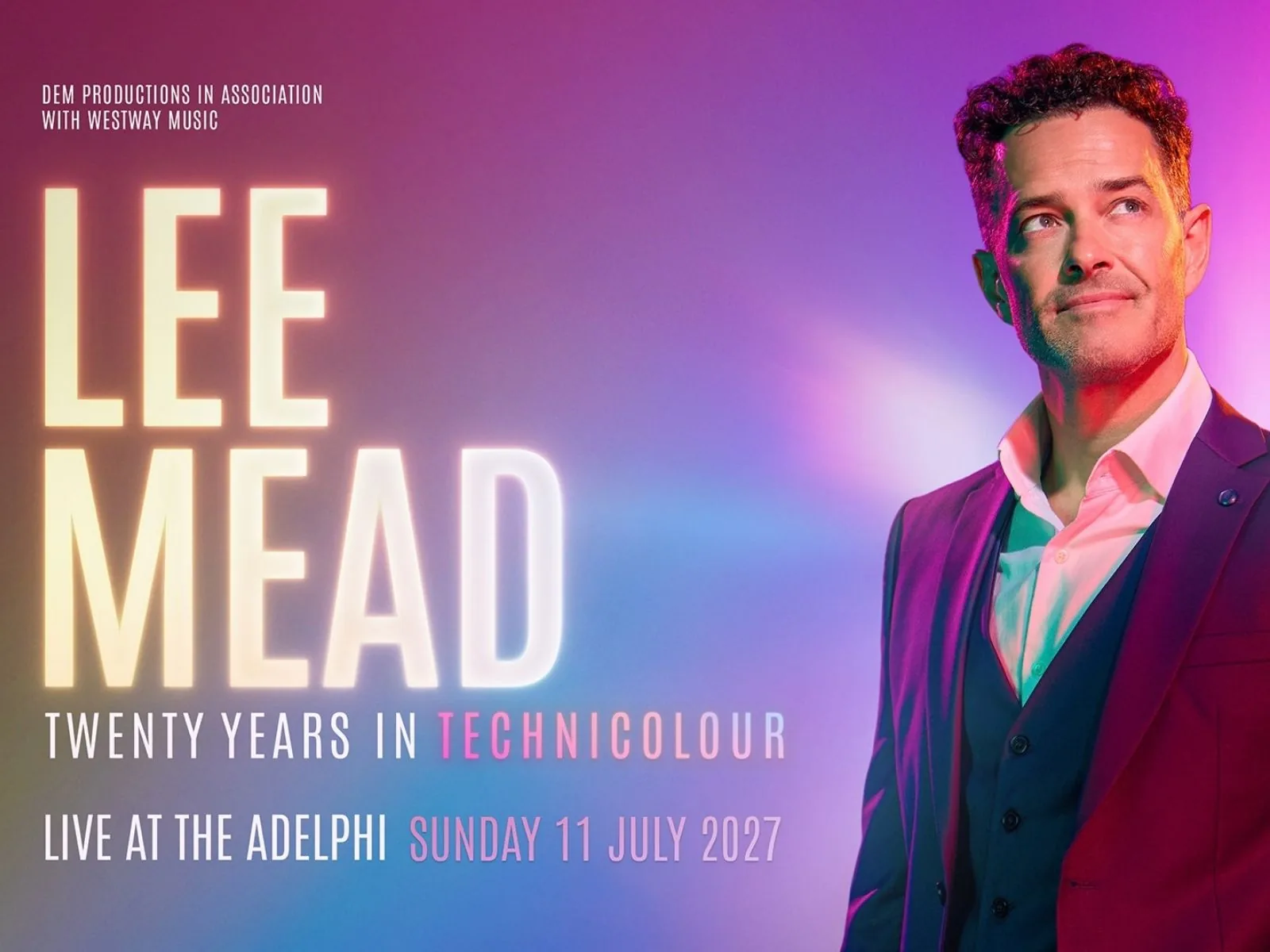 Man in burgundy jacket against pink gradient in Lee Mead at the Adelphi Theatre