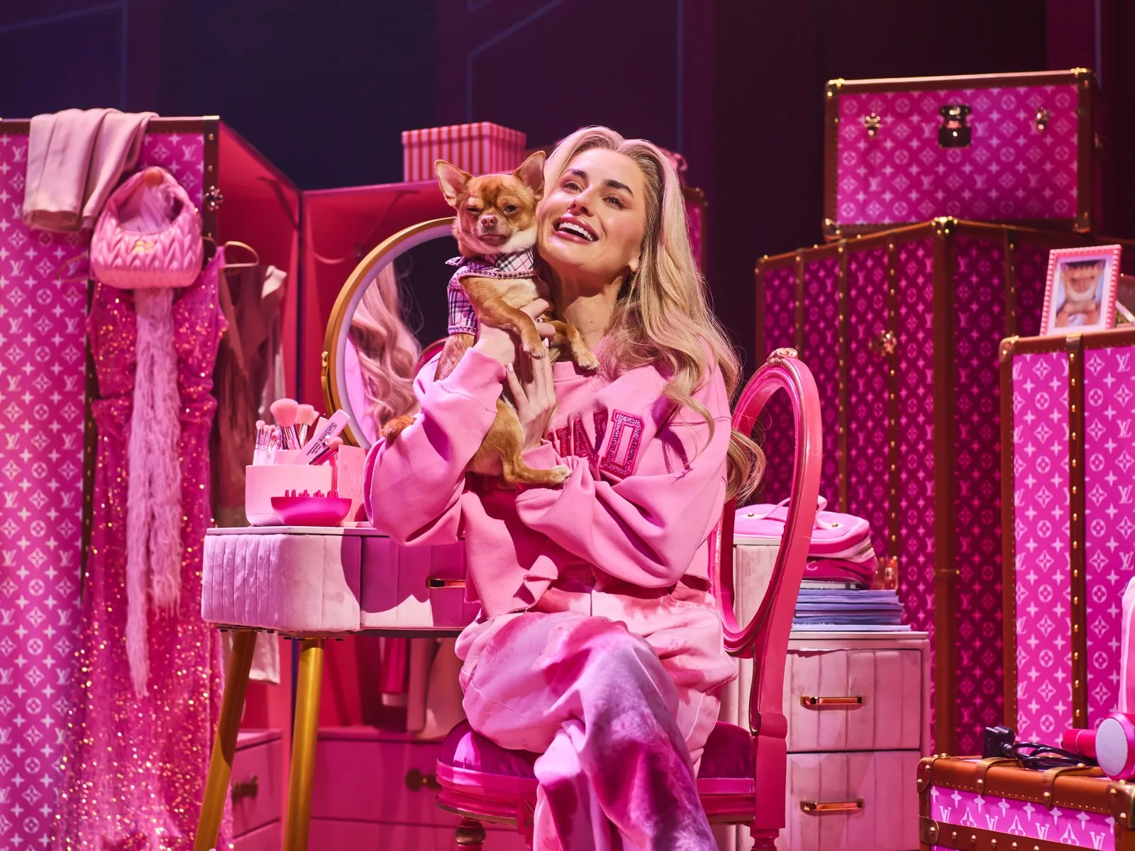 Elle Woods holds Bruiser the Chihuahua in her pink bedroom in Legally Blonde, London Coliseum