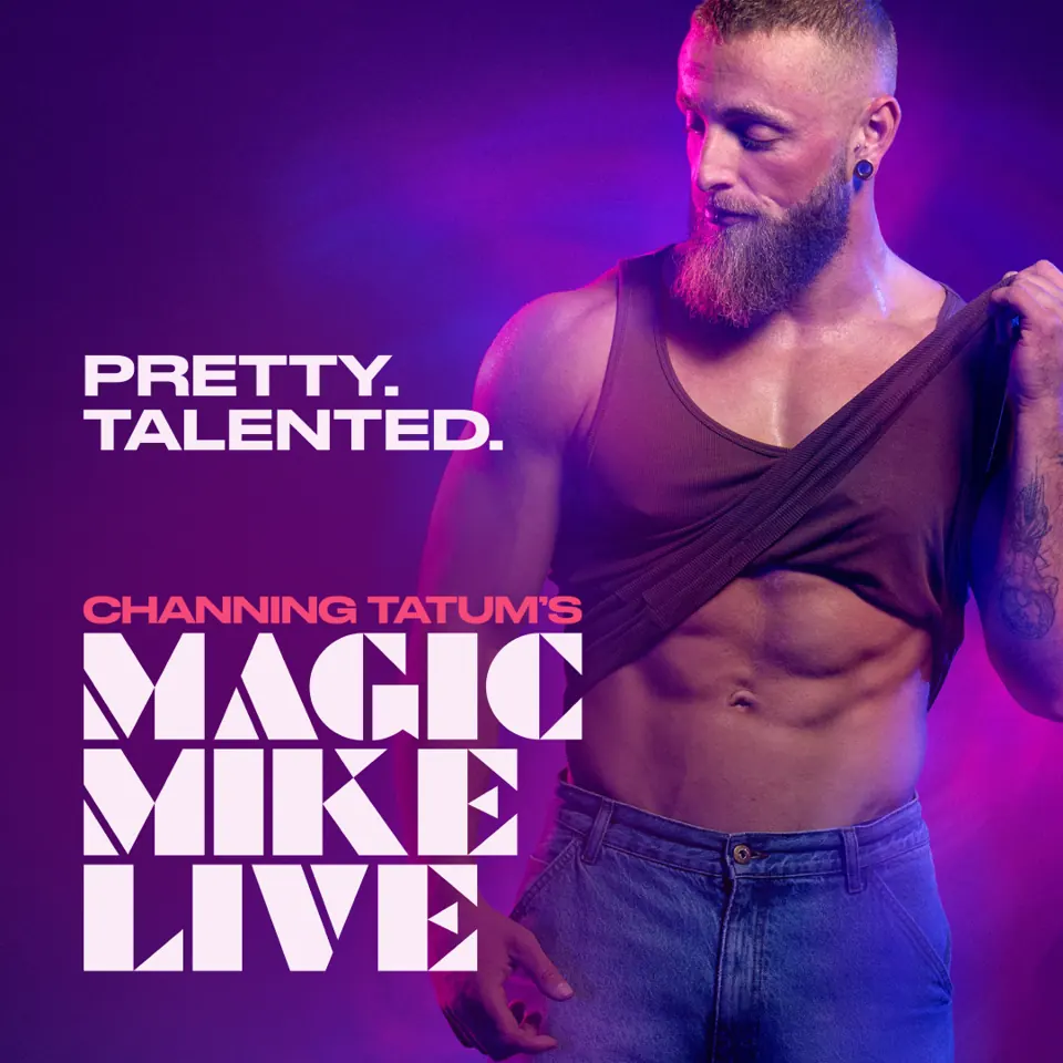 A bearded dancer lifts his vest under purple light, Magic Mike Live, Hippodrome Casino