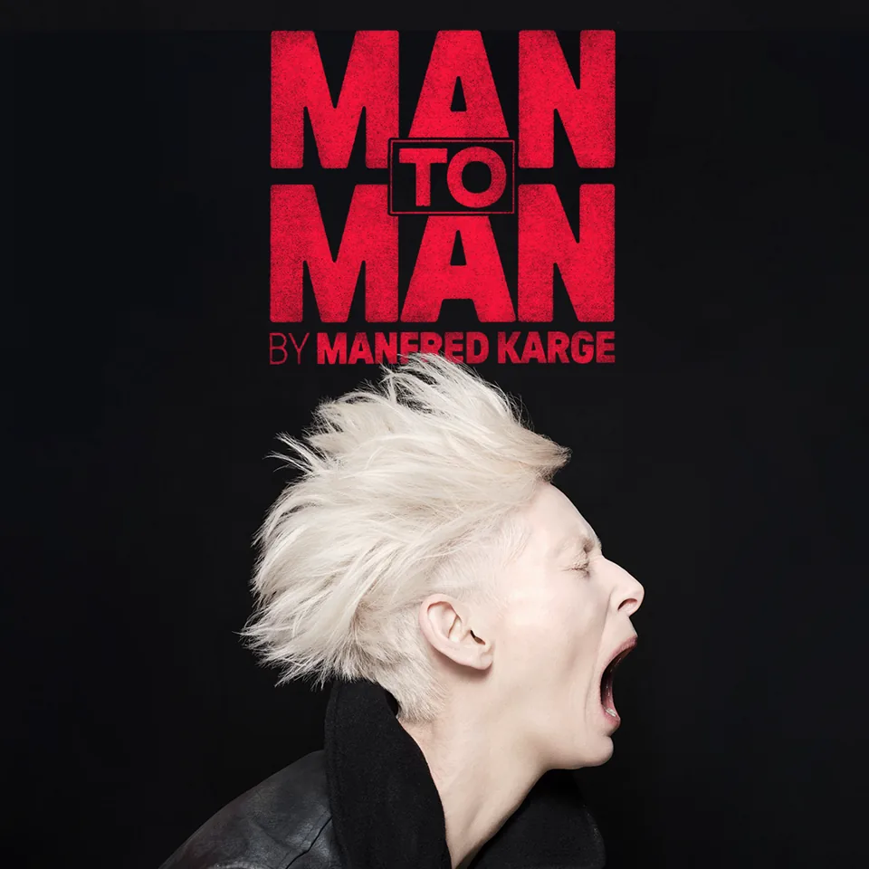 Person with spiky white hair in profile in Man to Man at the Royal Court