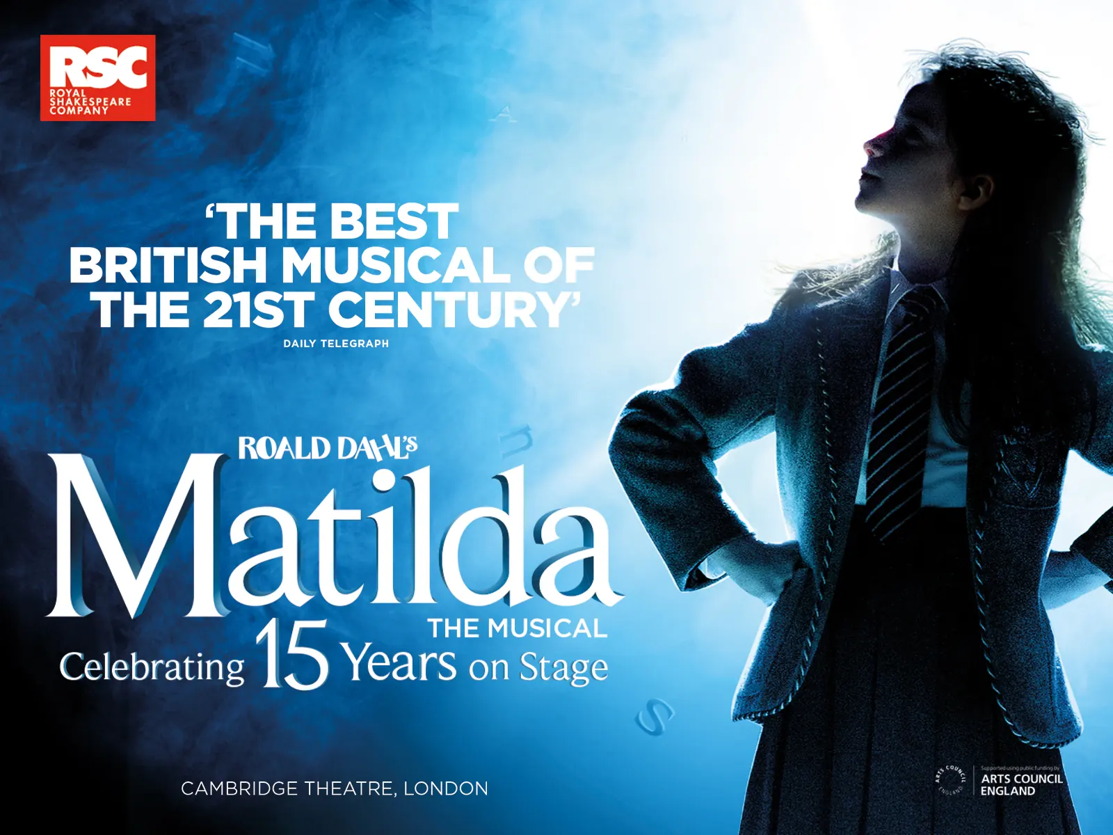 Wide Matilda The Musical 15th anniversary artwork: a defiant girl in blue smoke, Cambridge Theatre