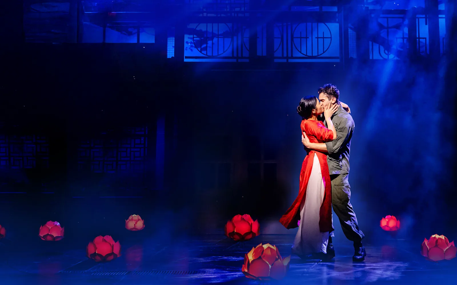Kim and Chris kiss among glowing red lotus lanterns, Miss Saigon, Prince Edward Theatre