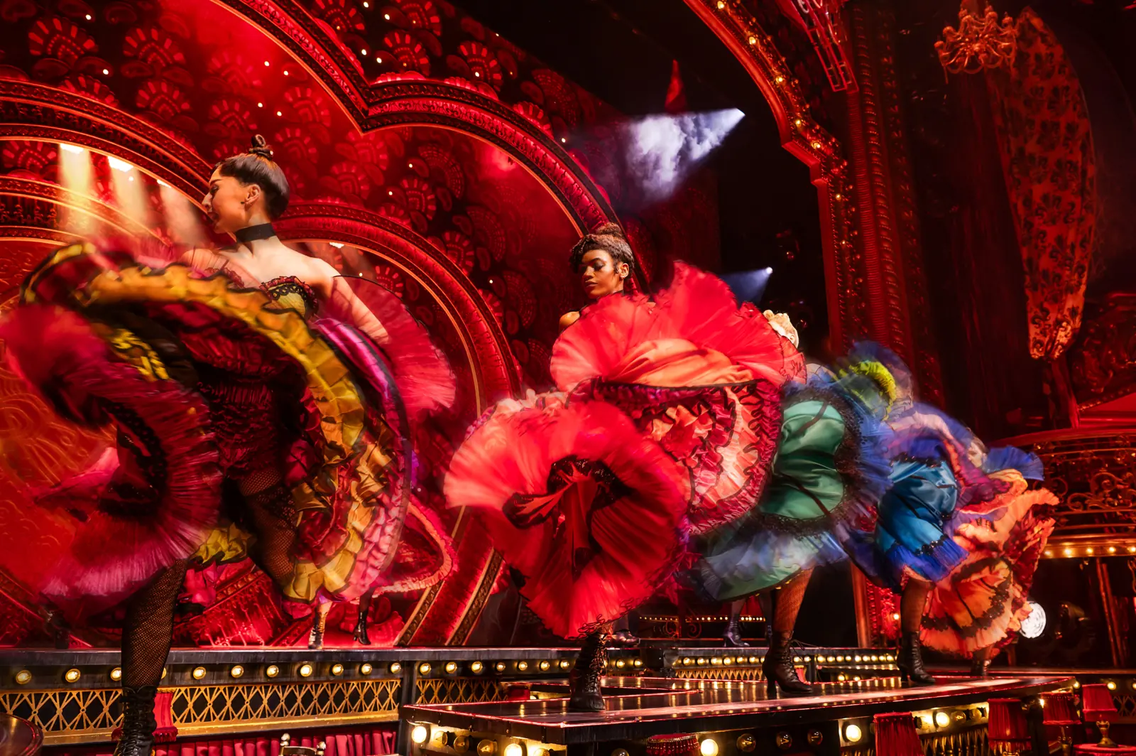 Dancers whirl red frilled skirts in a can-can, Moulin Rouge! The Musical, Piccadilly Theatre