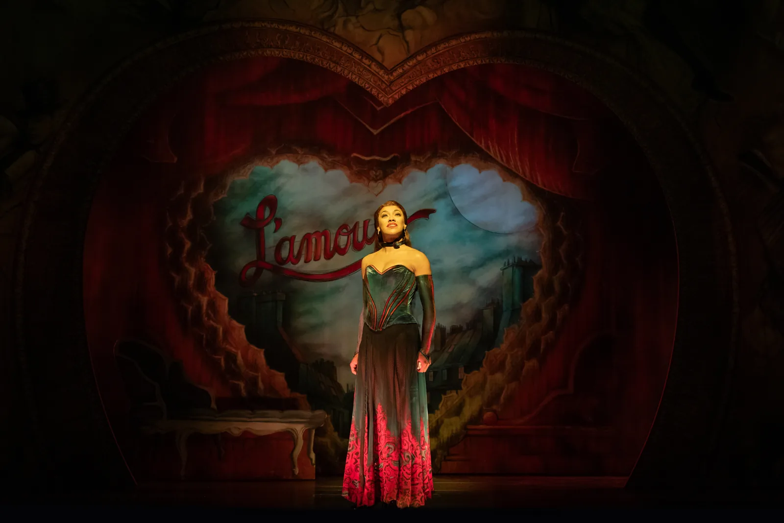 Karis Anderson as Satine sings in a long gown, Moulin Rouge! The Musical, Piccadilly Theatre
