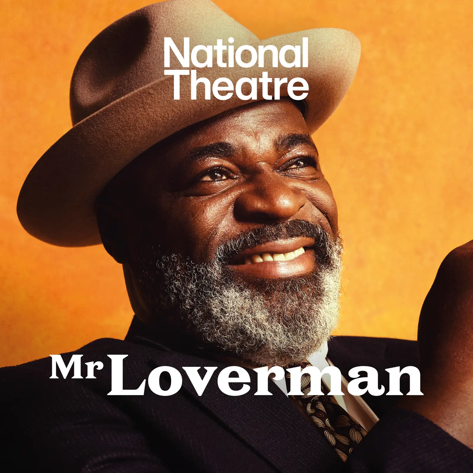 A man in brown cowboy hat smiles in Mr Loverman at the Lyttelton Theatre