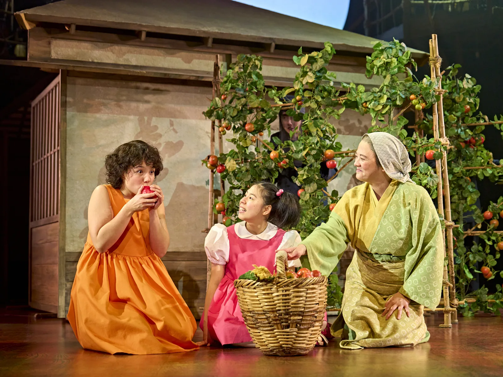 Satsuki and Mei share Granny's basket of vegetables in My Neighbour Totoro, Gillian Lynne Theatre