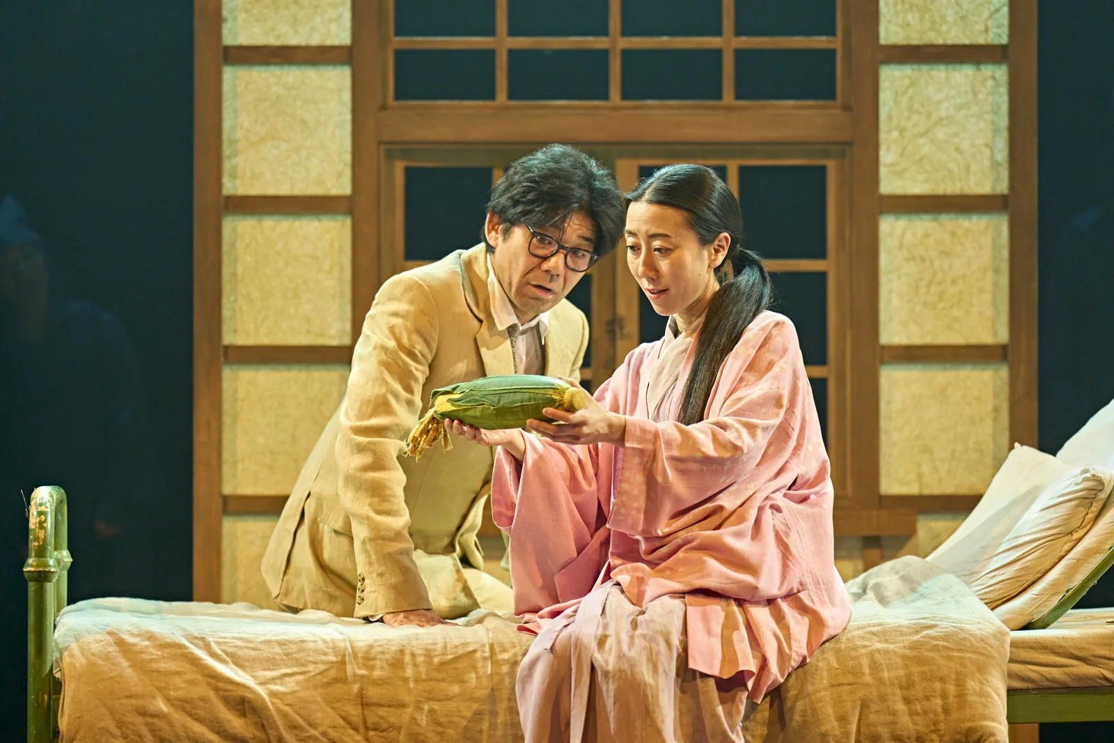 Tatsuo visits Yasuko in hospital, with the corn cob from Mei, My Neighbour Totoro