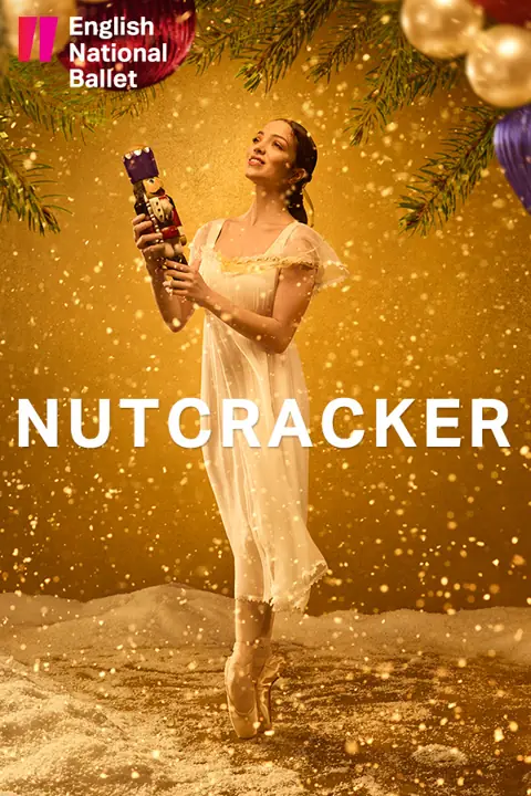 A ballerina en pointe holds the Nutcracker doll in golden snow, London Coliseum