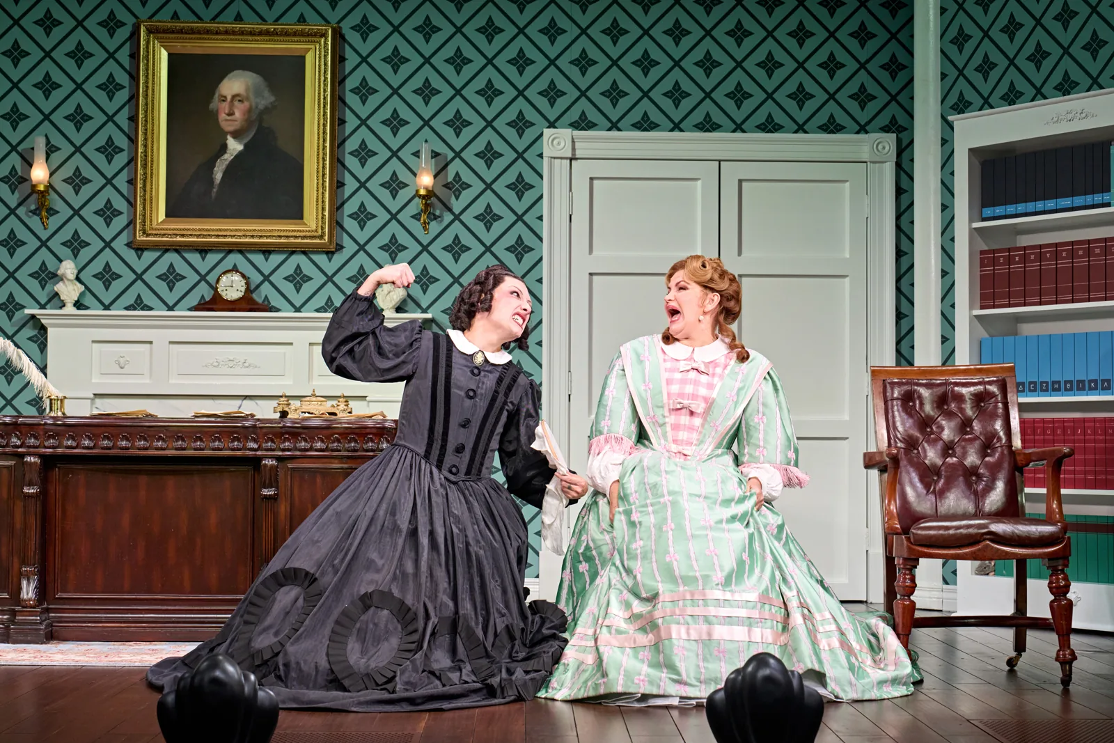 Mary Todd Lincoln and her chaperone sit on the floor in Oh, Mary!, Trafalgar Theatre