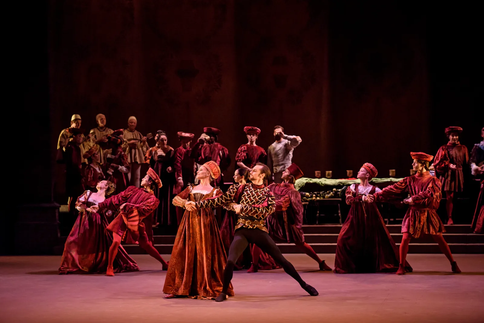 Dancers in rich court dress at the Capulet ball, Romeo & Juliet, London Coliseum