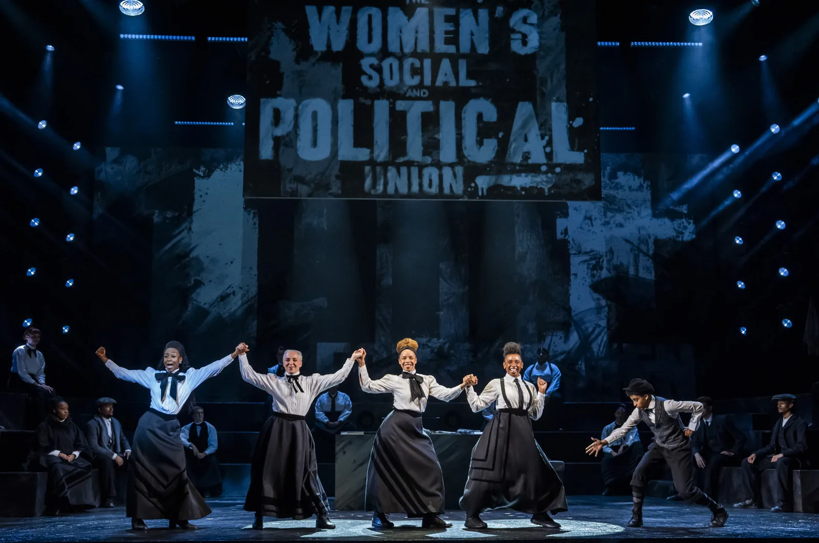 Arms raised beneath the Women's Social and Political Union banner, Sylvia, Royal Albert Hall