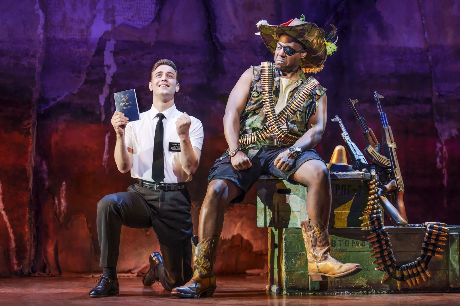 A kneeling missionary sings I Believe, The Book of Mormon, Prince of Wales Theatre