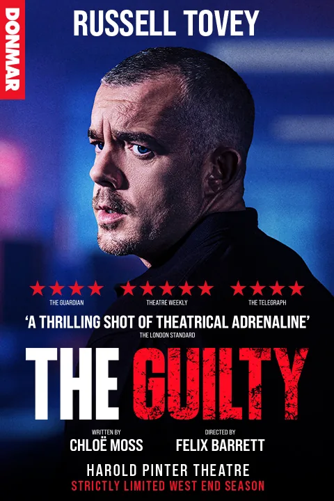 Russell Tovey with red and blue lighting in The Guilty at the Harold Pinter Theatre