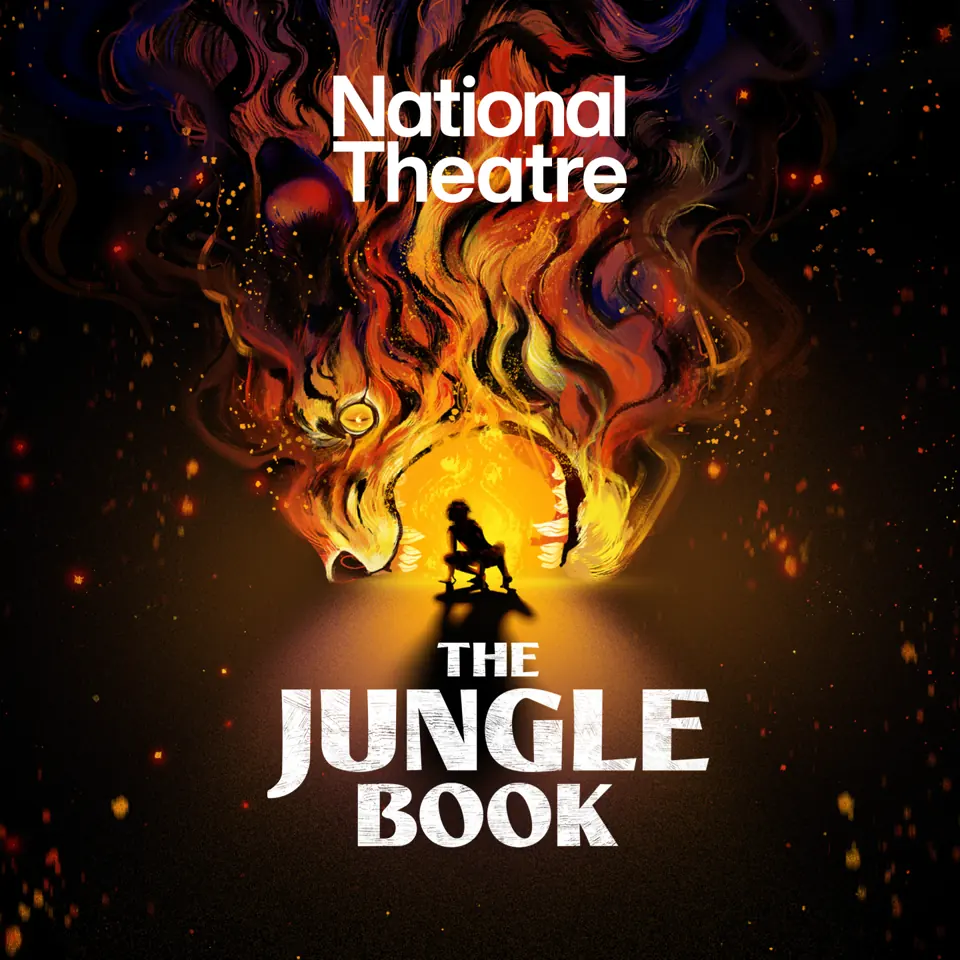 Figure silhouetted against roaring flames in The Jungle Book at the Olivier Theatre