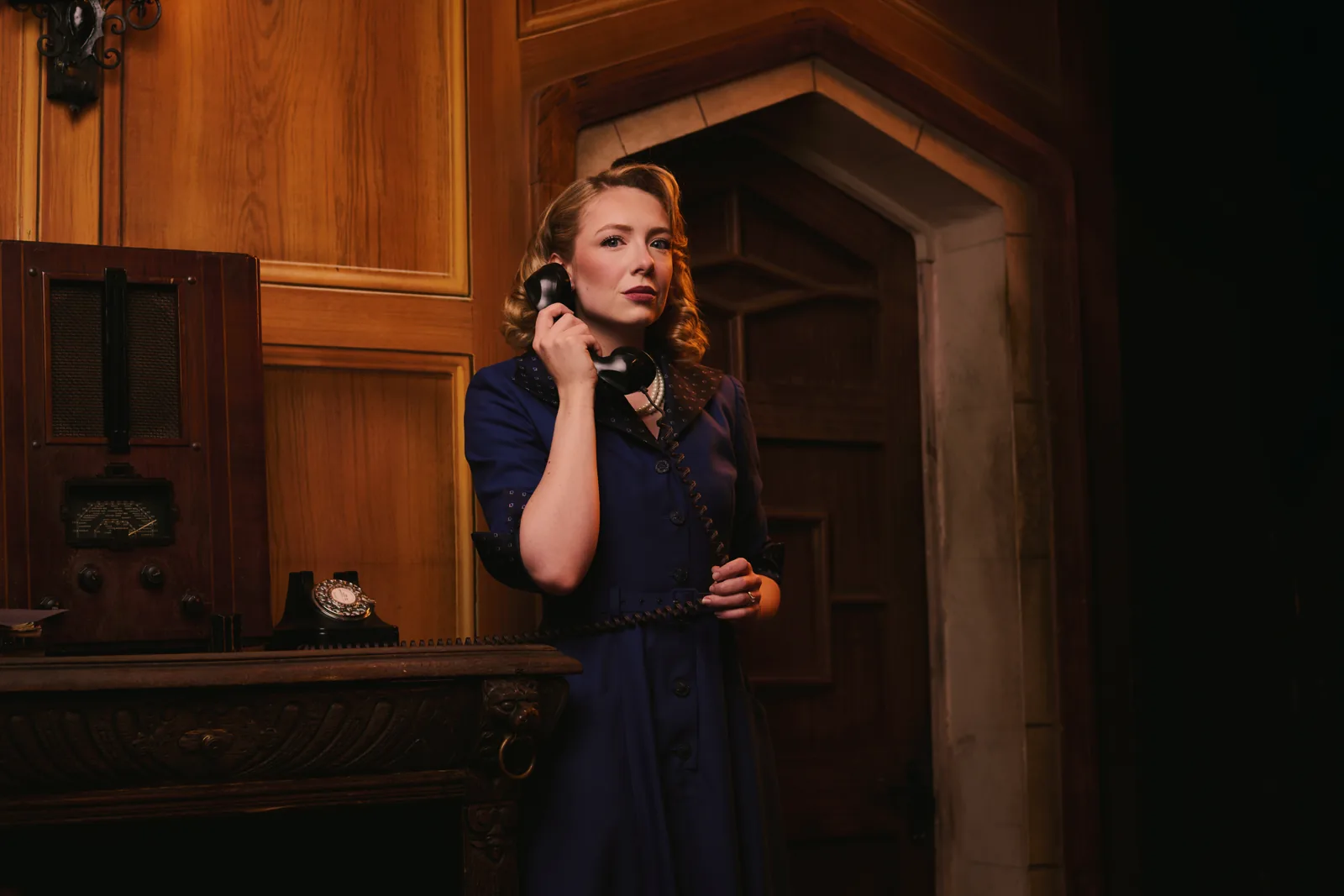 Saranna Parlone as Mollie Ralston, on the telephone, in The Mousetrap at St Martin's Theatre