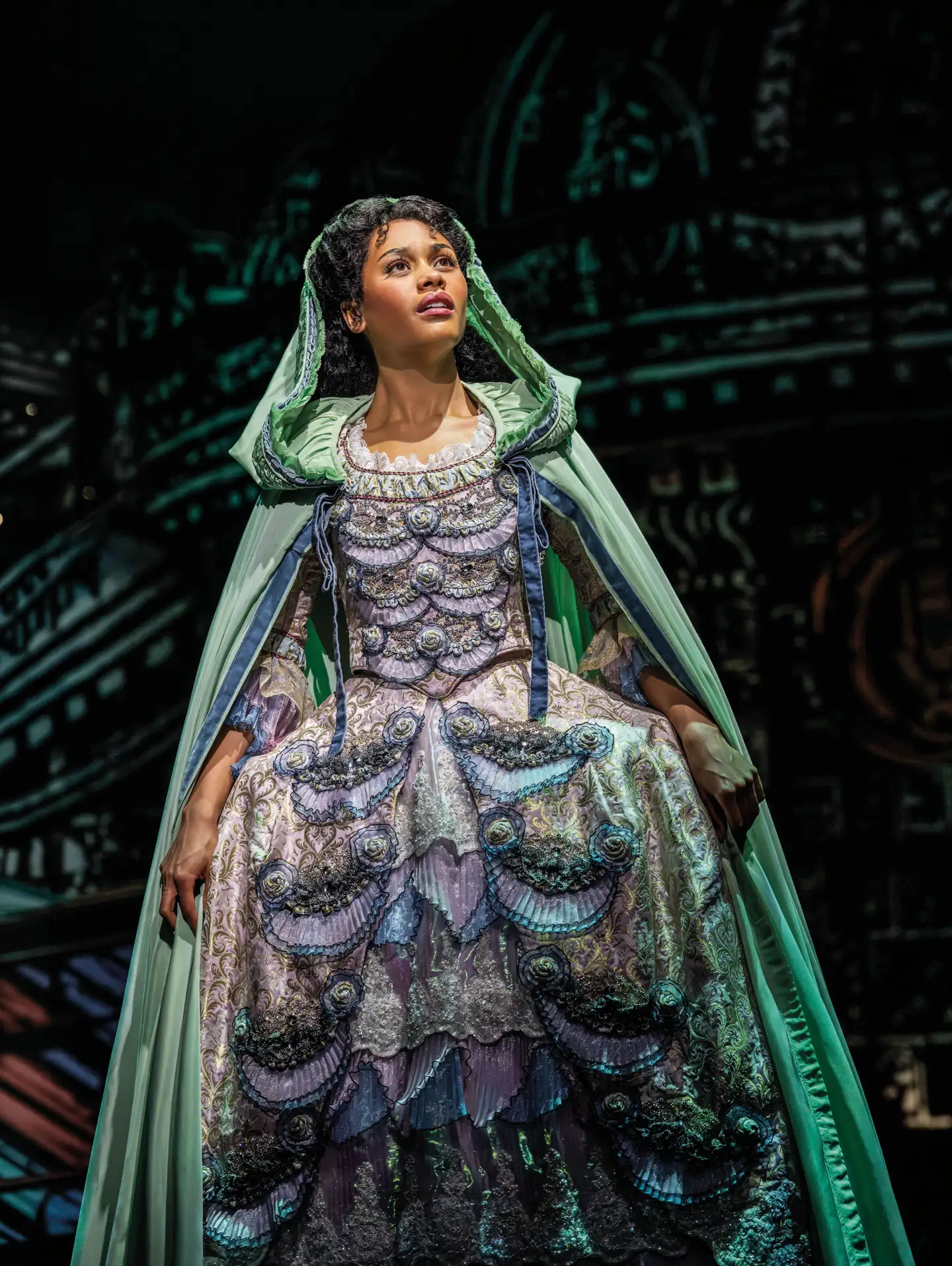 Beatrice Penny-Touré as Christine in a green cloak, The Phantom of the Opera, His Majesty's
