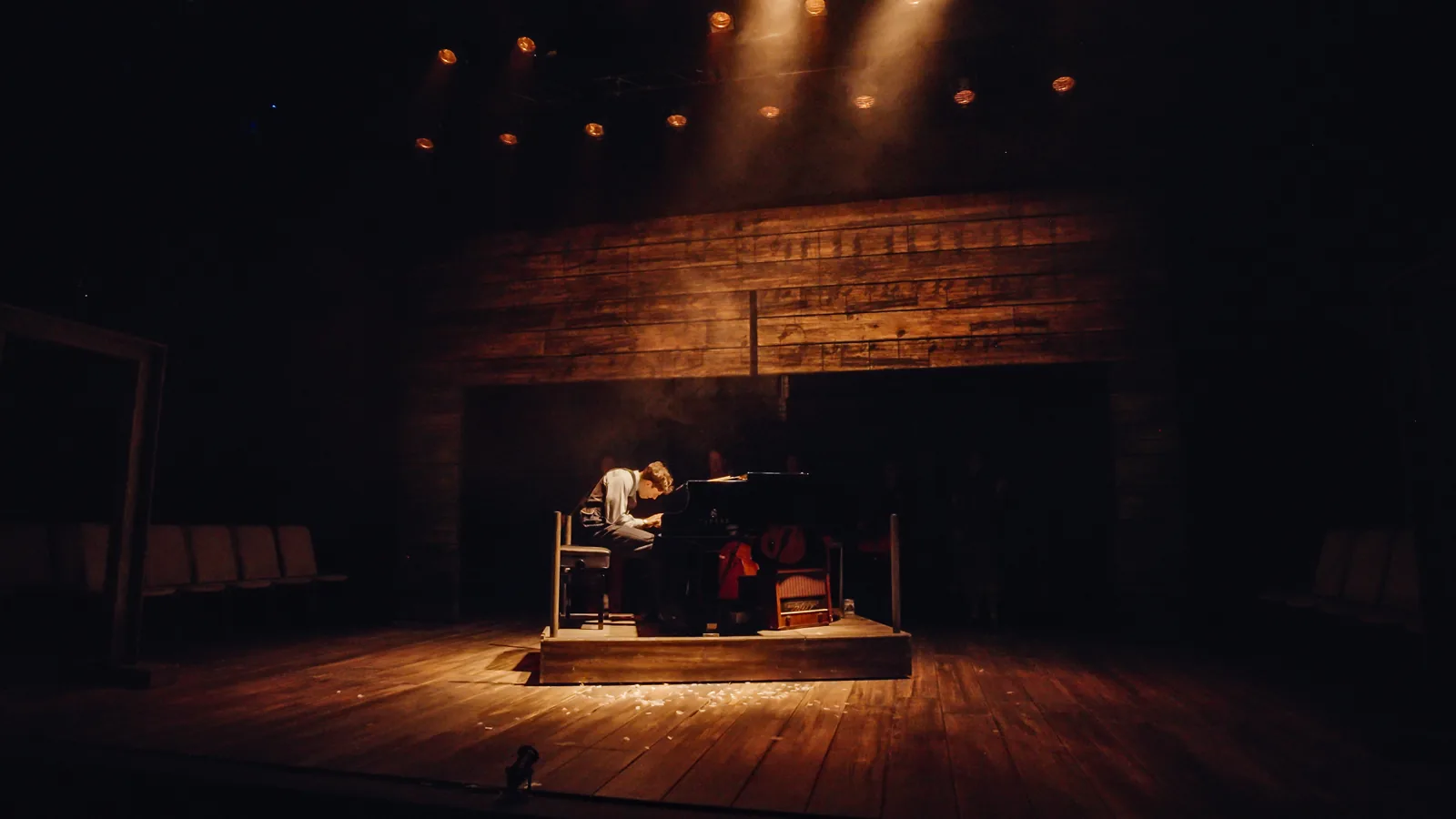 Daniel Krikler as Wladyslaw Szpilman alone at the piano in The Pianist, Park Theatre