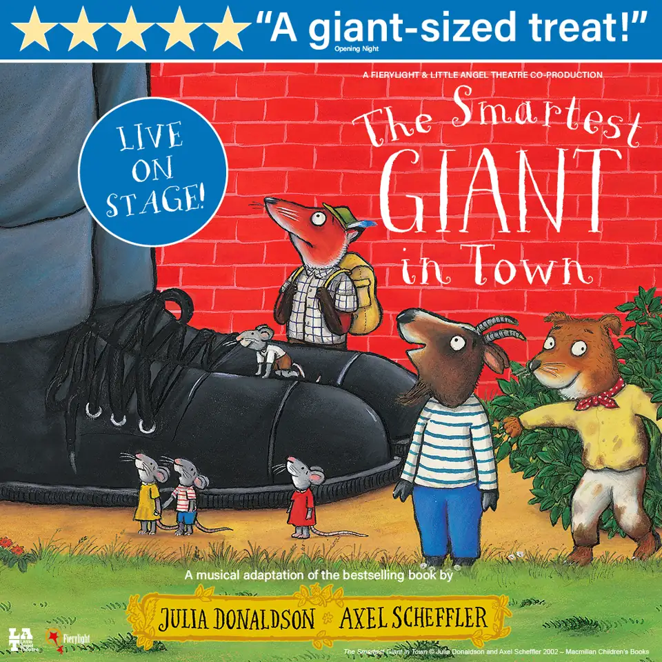 Giant in checked jacket in The Smartest Giant in Town at St. Martin's Theatre