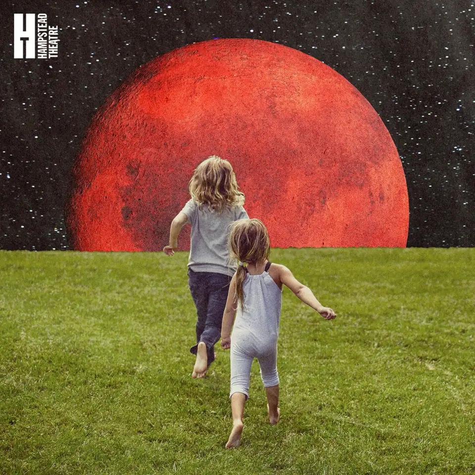 Two children run towards giant red sun in The Urmetazoan at the Hampstead Theatre