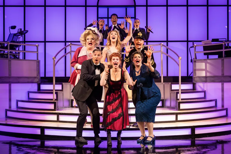 The Titanique company pull wild faces together on the tiered stage, Criterion Theatre