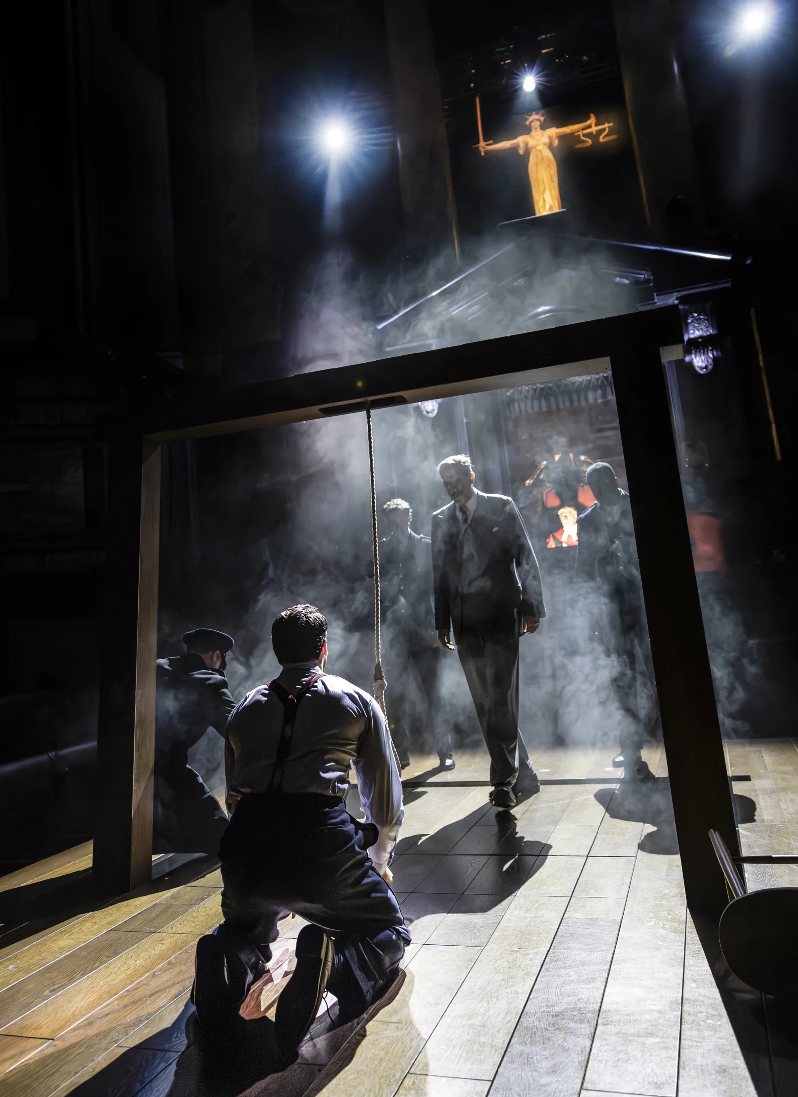 Smoke and shafts of light in a shadowy scene: Witness for the Prosecution, County Hall