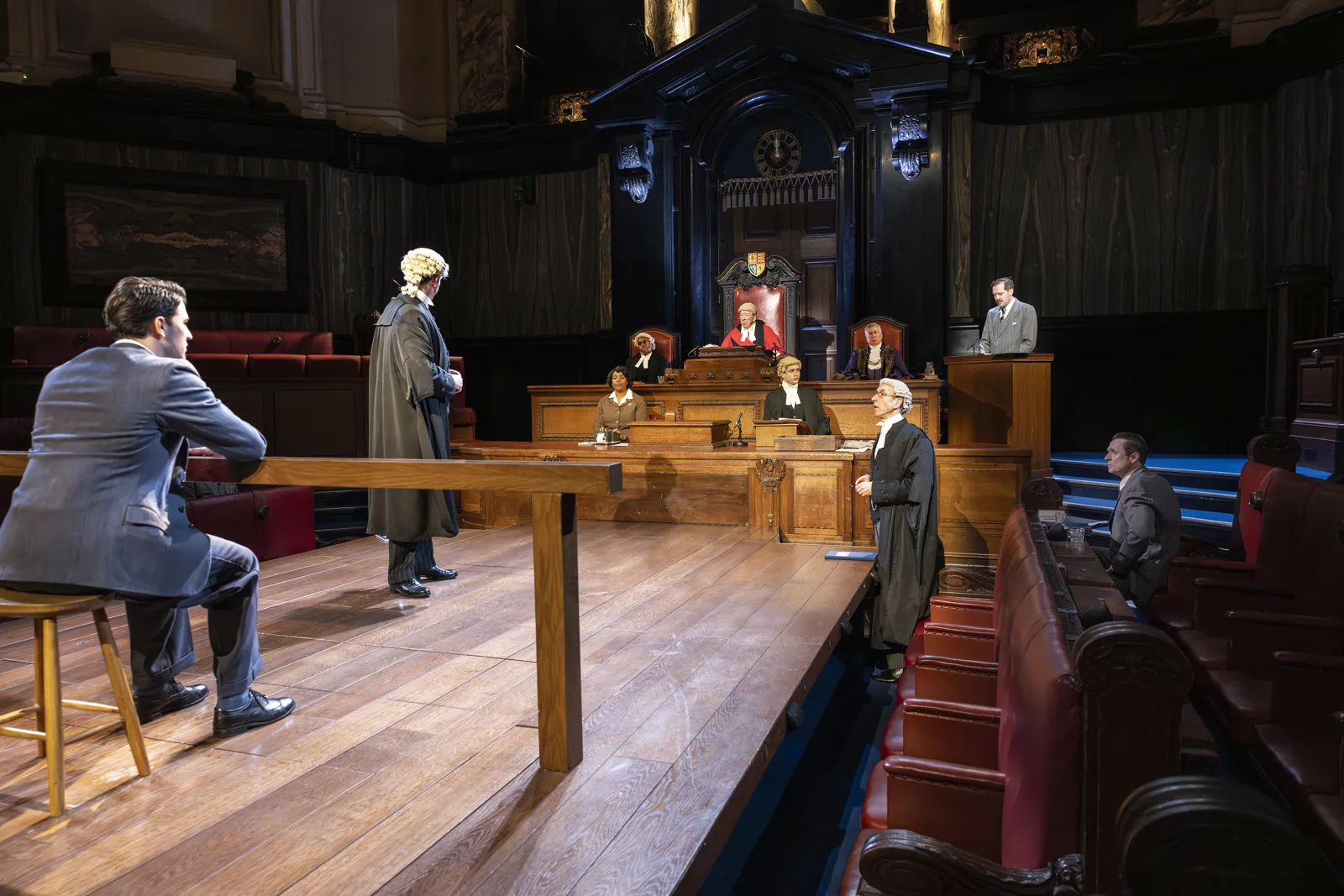 A man waits in the dock as barristers stand: Witness for the Prosecution, County Hall