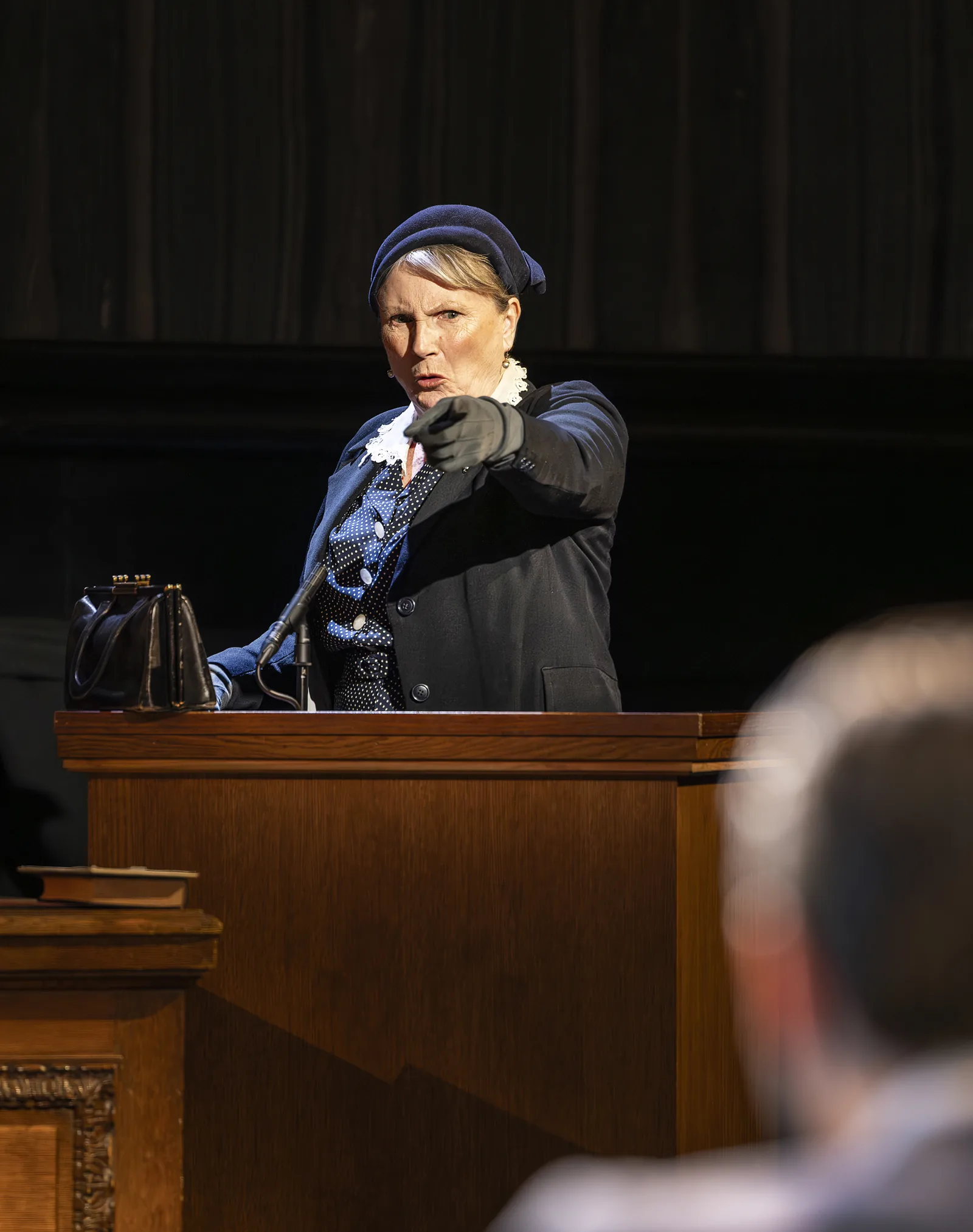 A woman points from the witness box: Witness for the Prosecution, London County Hall